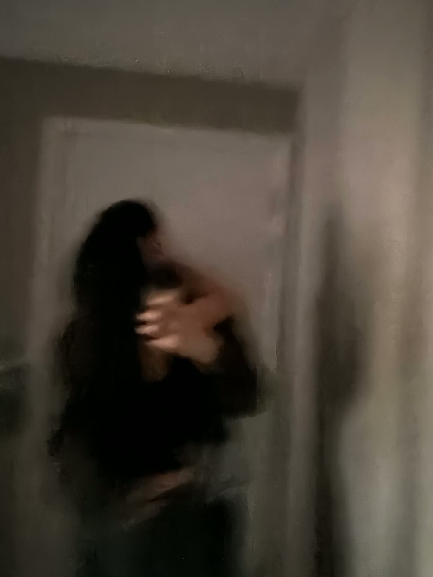 A soft blurred photo of the two of us in the mirror